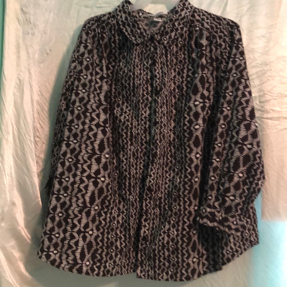 Roaman’s long sleeved button up shirt in a dark brownish black.
